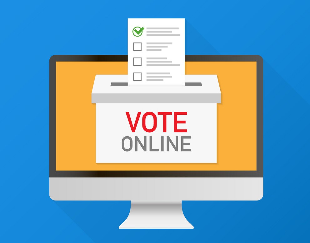 Voting online concept. Hand putting voting paper in the ballot b